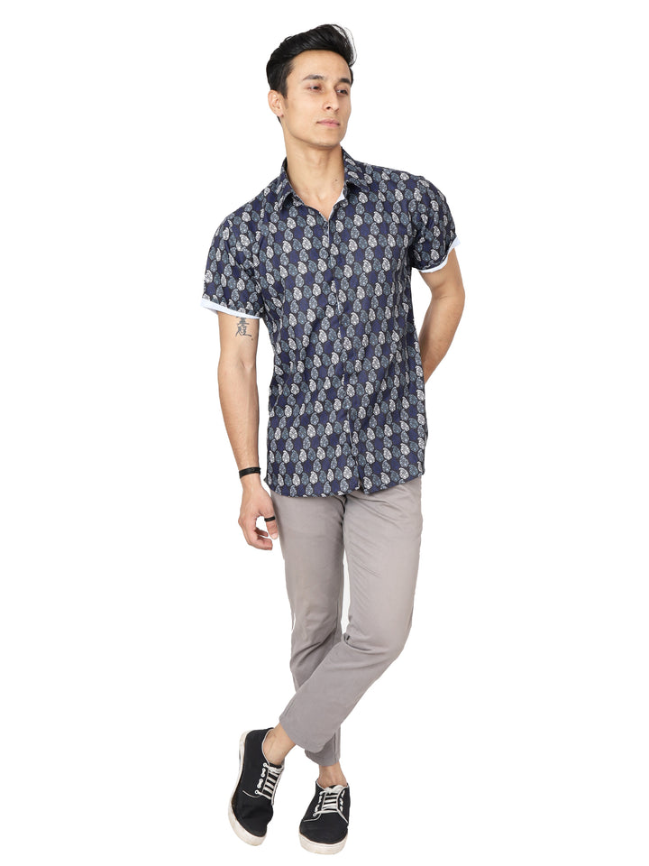 Model wearing half-sleeves digital printed blue casual shirt, grey trouser and black casual shoes