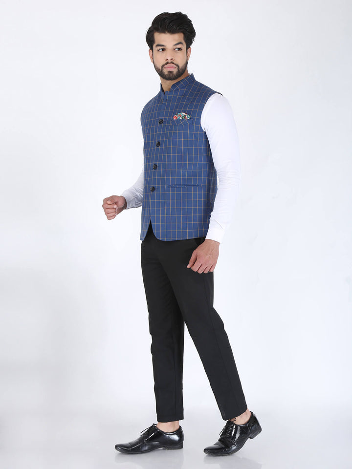 Model wearing Blue Checks formal Nehru Jacket on white shirt and black pant
