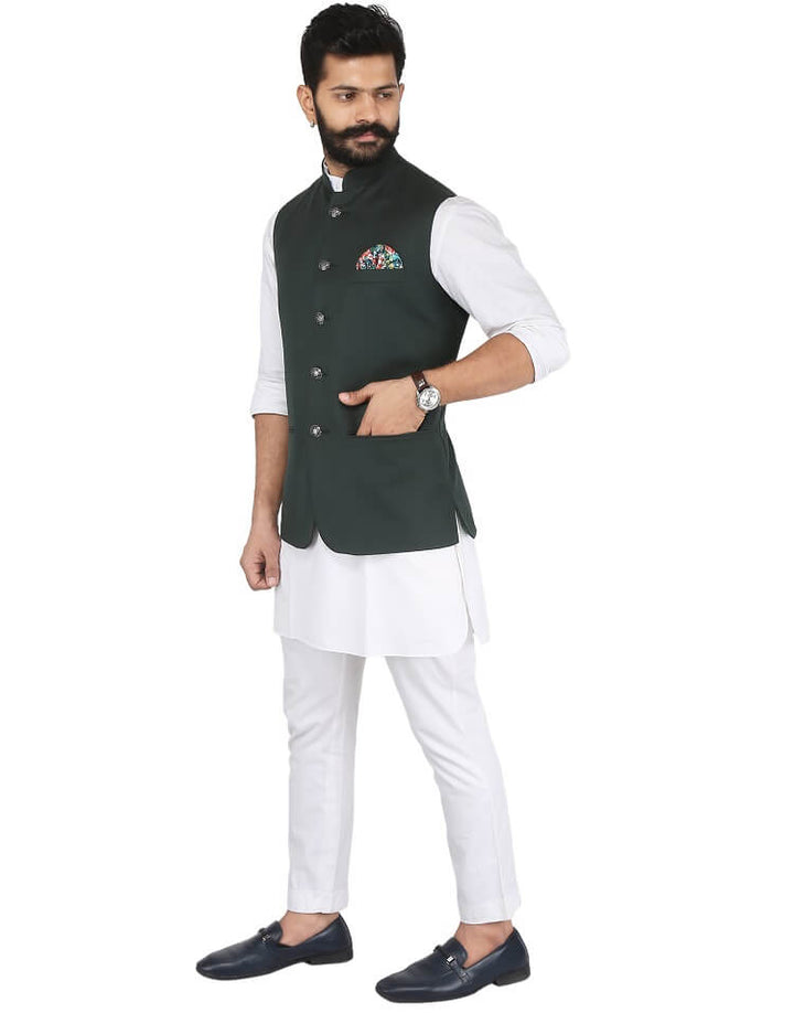 Model wearing Men's Green Solid Nehru jacket on white kurta pajama