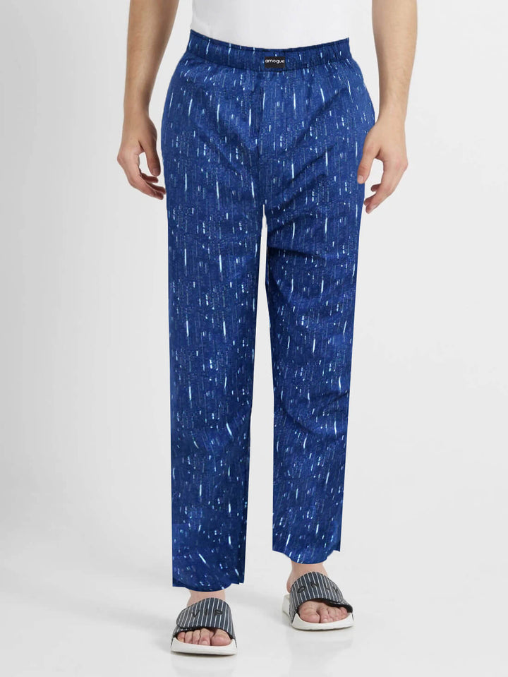 Man wearing Navy Blue Printed Regular Fit Pyjamas with casual flip flops